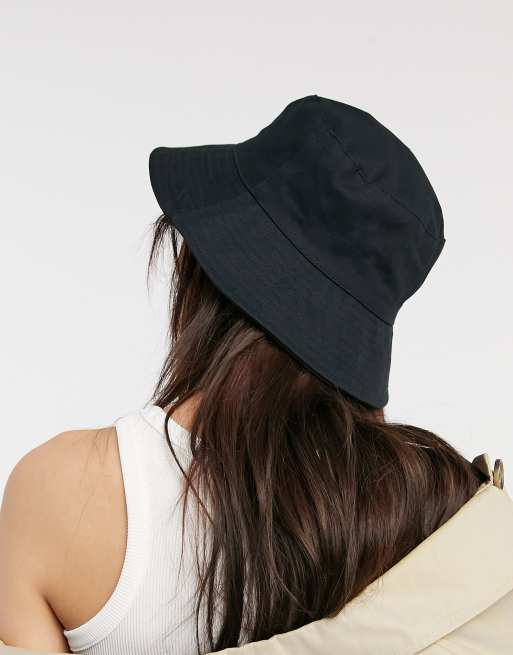 ASOS DESIGN canvas bucket hat with toggle detail in black