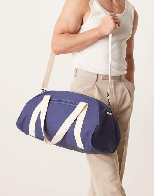 ASOS DESIGN canvas duffle bag in navy