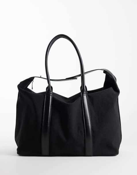 ASOS DESIGN canvas fabric holdall bag with faux leather straps in black - view 1