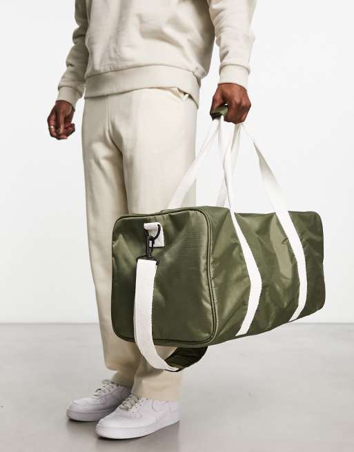 ASOS DESIGN canvas holdall bag with contrast strap in olive