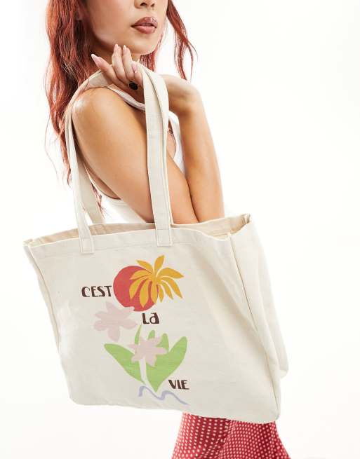 ASOS DESIGN canvas tote bag with cest la vie print in multi ASOS