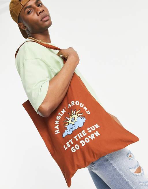 ASOS DESIGN canvas tote bag with sun print in tobacco