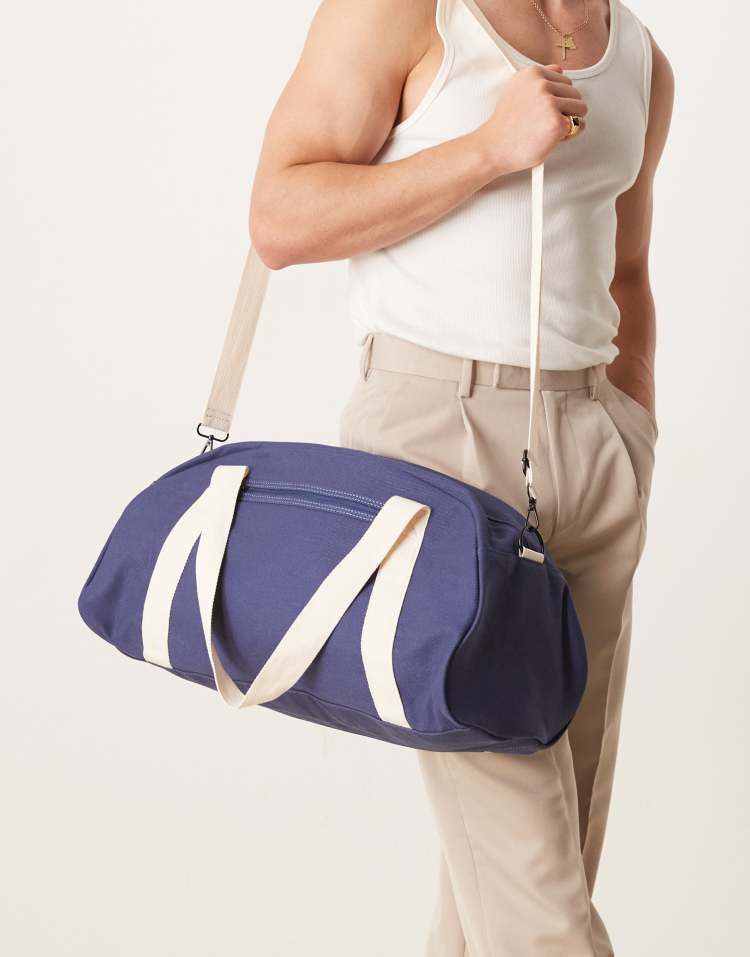 ASOS DESIGN canvas weekend duffel bag in navy and ecru - view 1