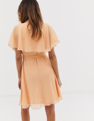 cape back dipped hem mini dress