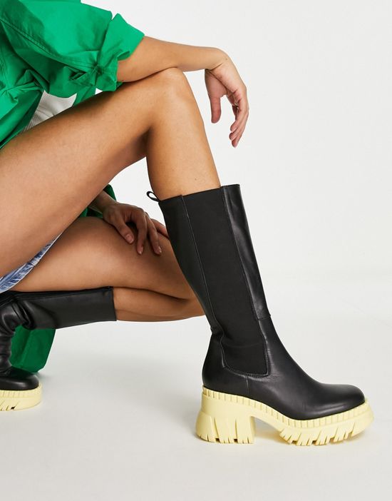 https://images.asos-media.com/products/asos-design-capricorn-premium-leather-chunky-chelsea-knee-boots-in-black-with-yellow-sole/202107513-1-black?$n_550w$&wid=550&fit=constrain