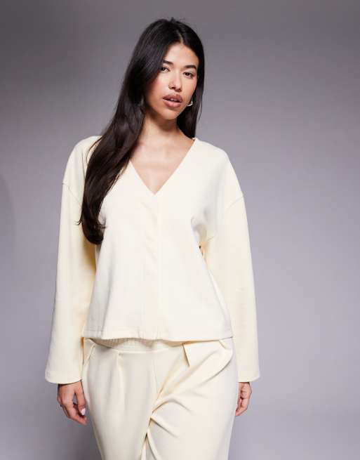 ASOS DESIGN - Cardigan taglio corto in tessuto interlock color crema con scollo a V e maniche lunghe in coordinato