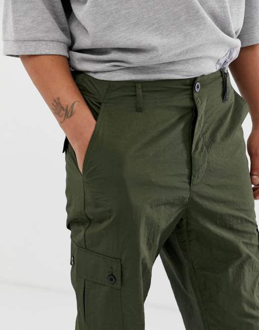 ASOS DESIGN relaxed cargo pants in dark green cord