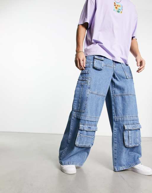 ASOS DESIGN - Cargojeans met extreem wijde pijpen en zakken in blauw met mid-wash