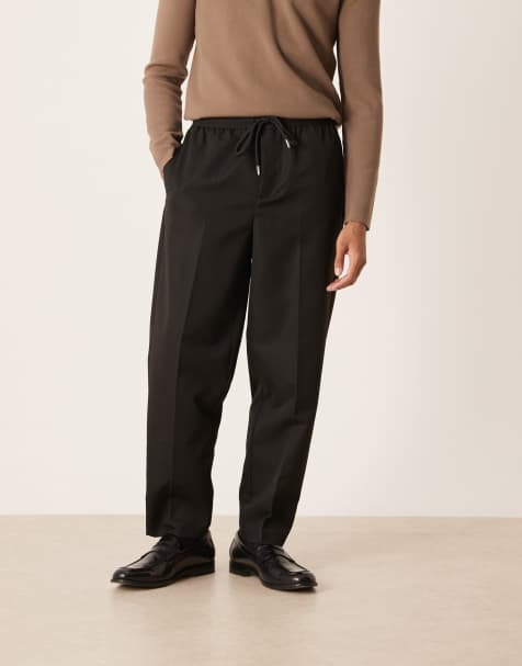 ASOS DESIGN carrot fit pants with elasticated waistband in black - view 1