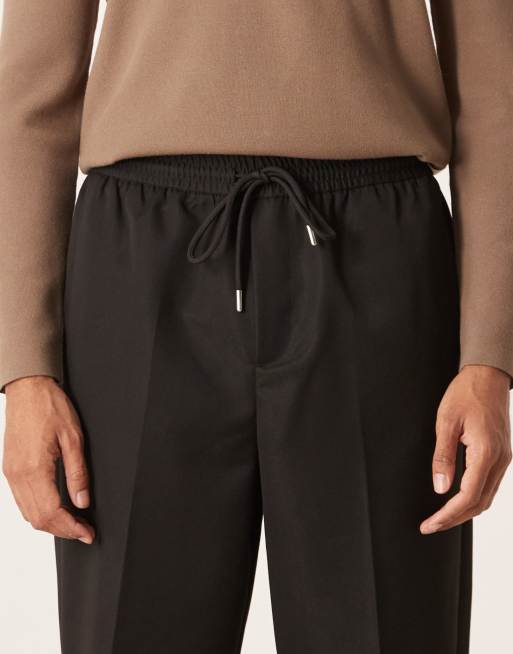 ASOS DESIGN carrot fit pants with elasticated waistband in black, 5 of 5