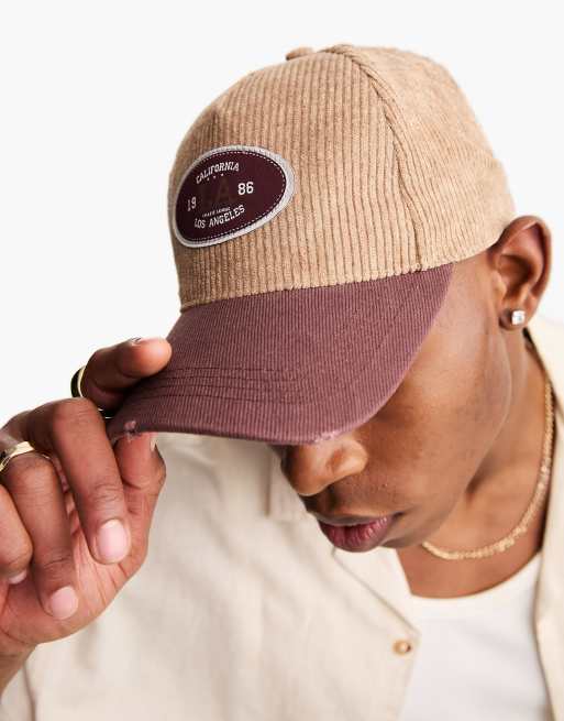 ASOS DESIGN - Casquette de baseball en velours côtelé avec visière contrastante effet usé - Marron