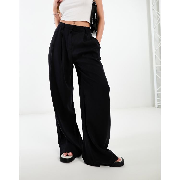 ASOS DESIGN wide leg suit pants in black and orange swirl print