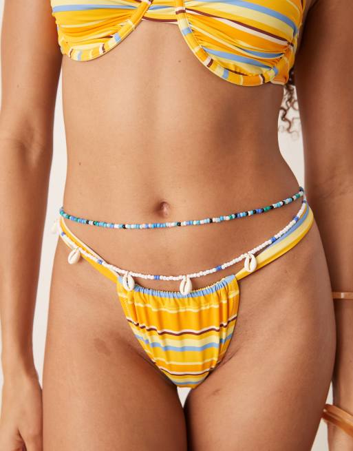 ASOS DESIGN - Catenina per pancia multifilo color oro con conchiglie sintetiche e perline