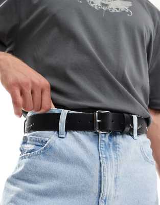 ASOS DESIGN - Ceinture en imitation cuir avec motif toile d'araignée cloutée - Noir