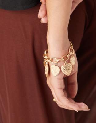 chain bracelet with heart charms in worn gold tone