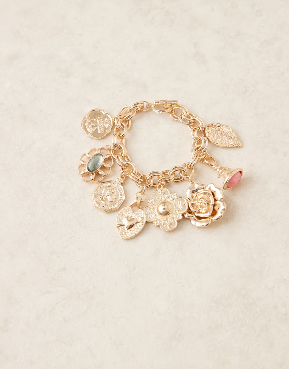 ASOS DESIGN chain bracelet with mixed charms in gold tone