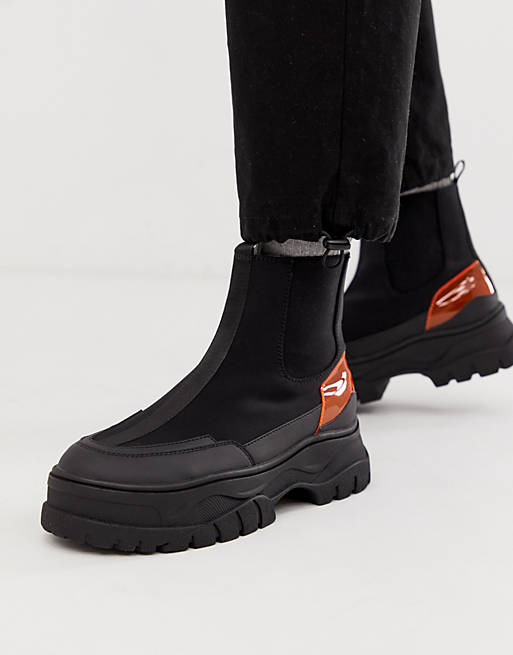 ASOS DESIGN chelsea boots in black with chunky sole and neon pop detail ...