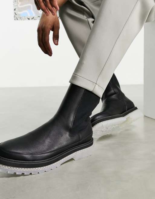 ASOS DESIGN chelsea calf boots in black faux leather with translucent chunky sole