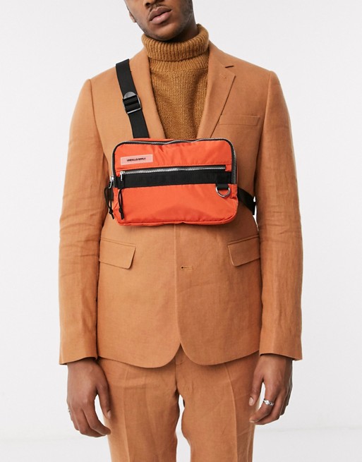 ASOS DESIGN rave chest harness bag in orange