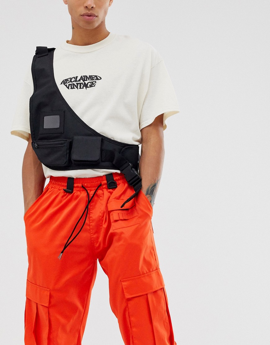 ASOS DESIGN chest harness vest bag in black with pockets