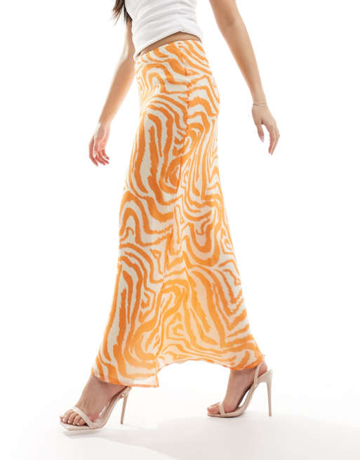 ASOS DESIGN chiffon bias maxi skirt in orange animal print