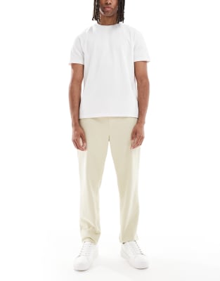 ASOS DESIGN – Chinohose in Karottenform zum Reinschlüpfen in Beige - view 1