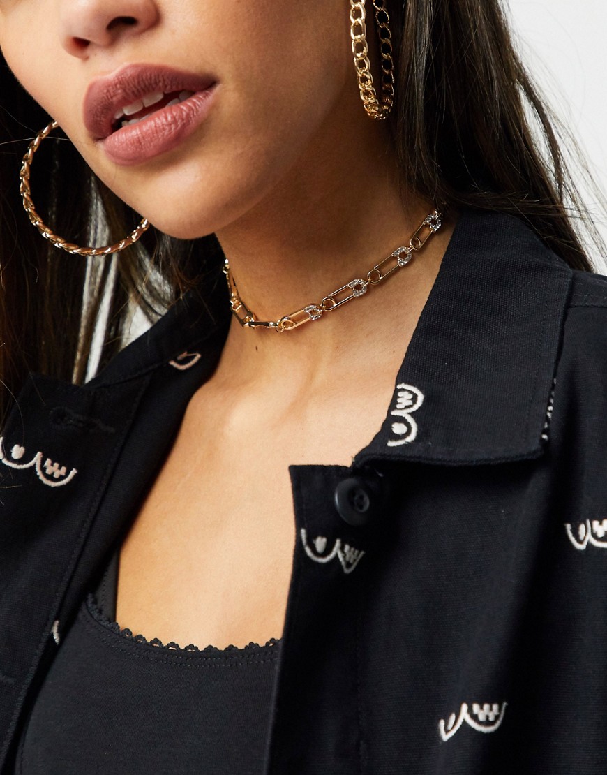 ASOS DESIGN choker necklace in safety pin design in gold tone