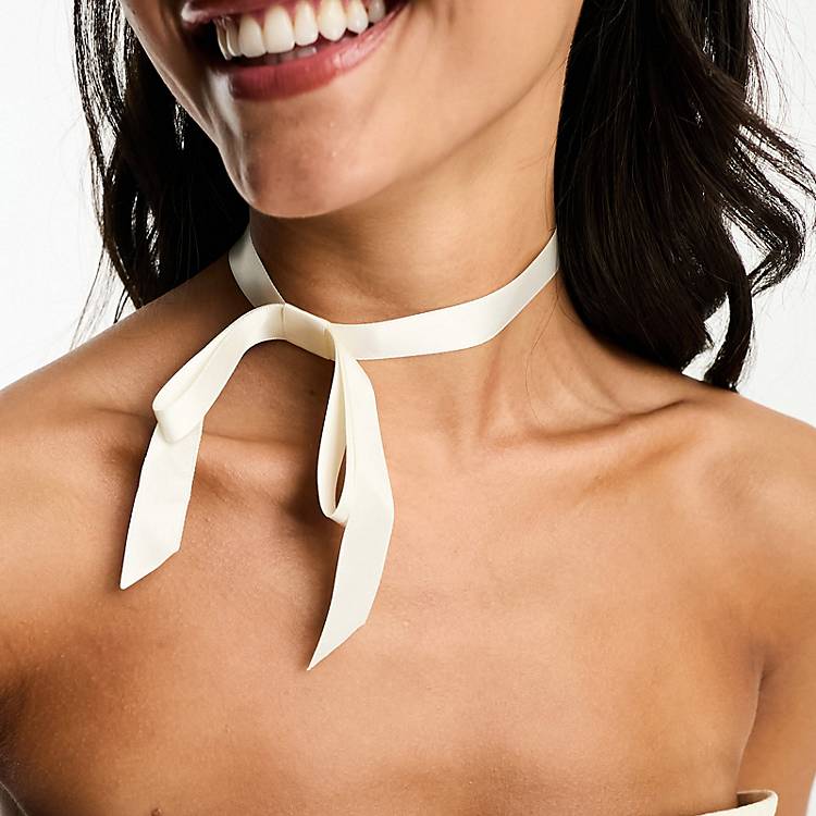ASOS DESIGN choker necklace with bow ribbon design in cream