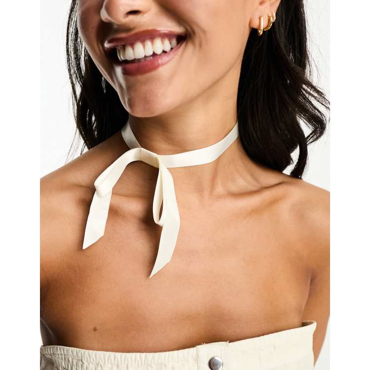 ASOS DESIGN choker necklace with bow ribbon design in cream