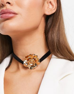 ASOS DESIGN choker necklace with gold rose design in black velvet