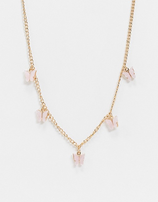 ASOS DESIGN choker necklace with pink butterfly charms in gold tone