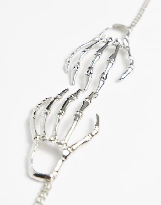 ASOS DESIGN choker necklace with skeleton hands in silver tone