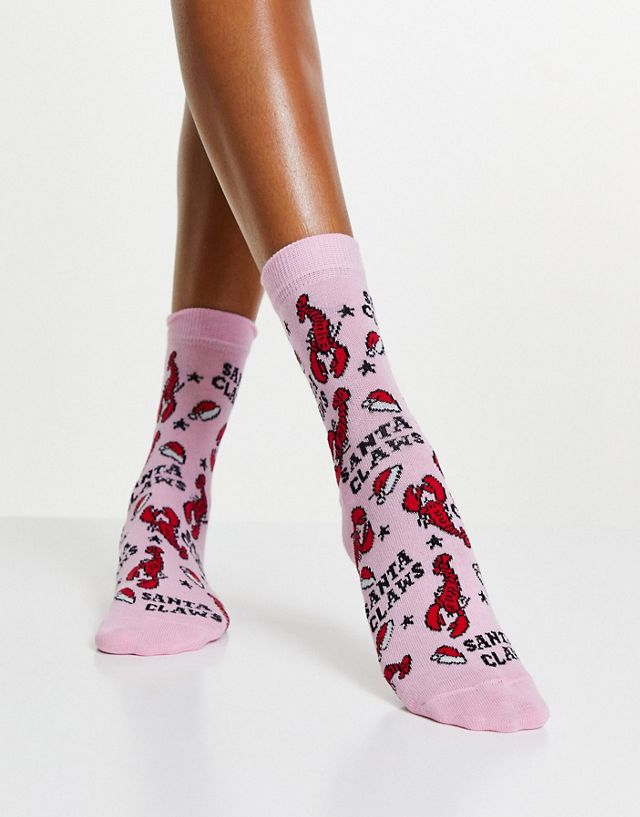 ASOS DESIGN Christmas ankle socks in Santa Claws print in pink