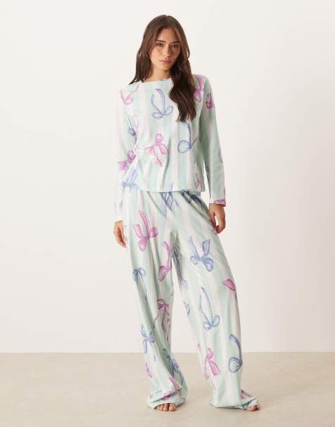 ASOS DESIGN Christmas bow long sleeve top & trouser pyjama set in blue stripe - view 1