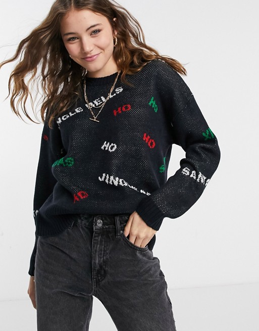 ASOS DESIGN Christmas oversized jumper with multi slogan in black
