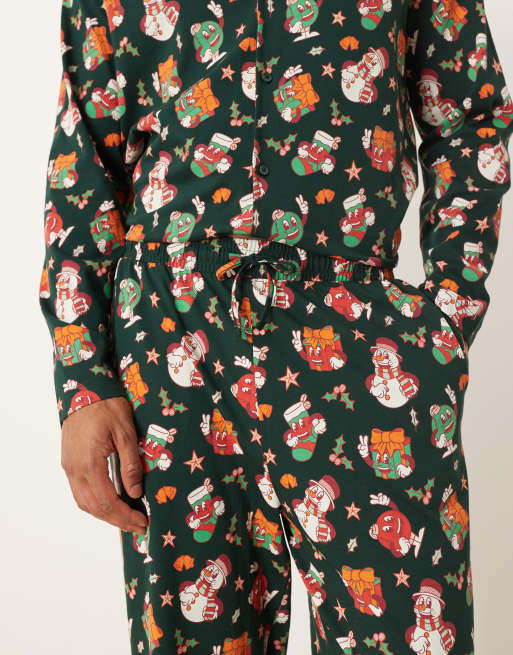 ASOS DESIGN Christmas pajama set with characters graphic in green