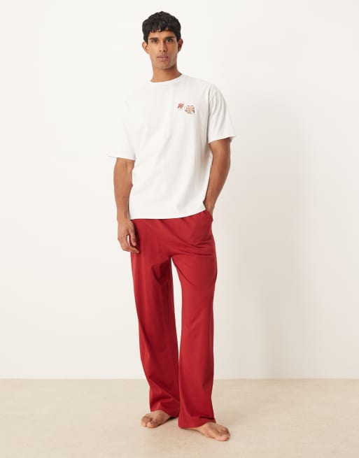 ASOS DESIGN Christmas pajama set with characters graphic in red
