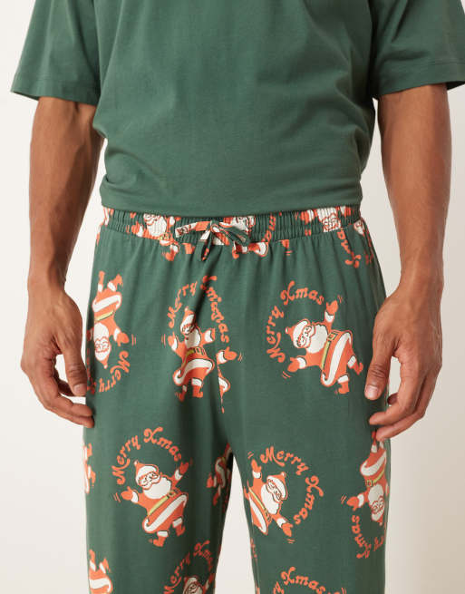ASOS DESIGN Christmas pajama set with vintage Santa graphics in green
