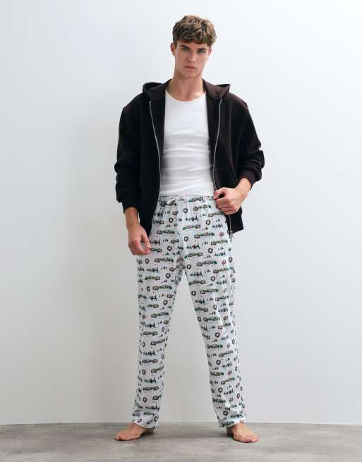 ASOS DESIGN Christmas pyjama bottoms with festive village graphic in white, 2 of 5