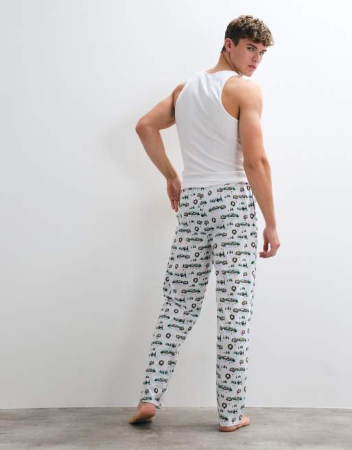ASOS DESIGN Christmas pyjama bottoms with festive village graphic in white, 4 of 5