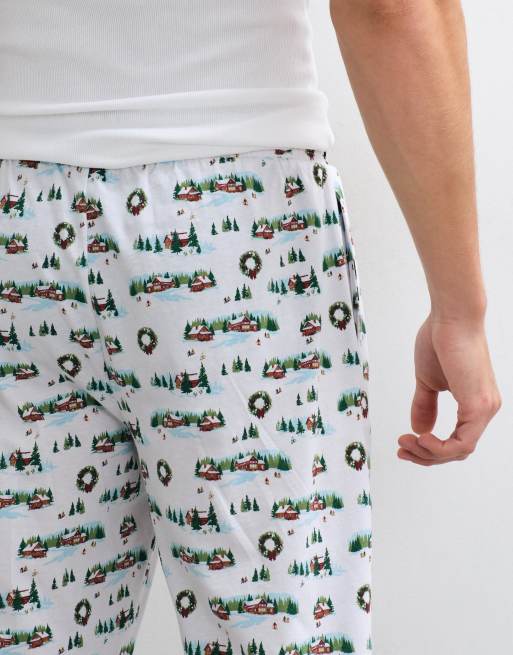 ASOS DESIGN Christmas pyjama bottoms with festive village graphic in white, 5 of 5