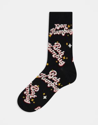 ASOS DESIGN Christmas socks with bah humbug slogan in black