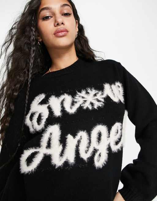 ASOS DESIGN Christmas sweater with fluffy snow angel pattern in black | ASOS