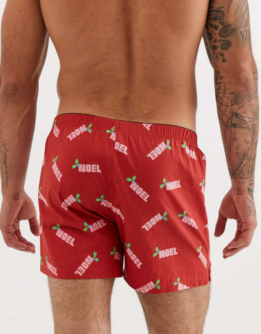 ASOS DESIGN Christmas woven boxer short in red with noel slogan