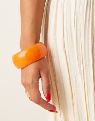 ASOS DESIGN chunky bangle in bright orange resin - view 1