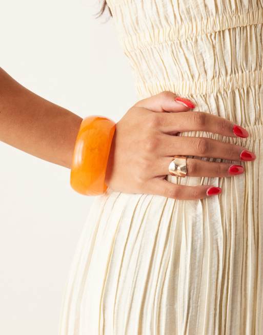 ASOS DESIGN chunky bangle in bright orange resin