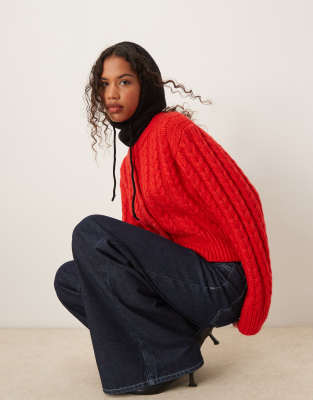 chunky crew neck cardigan in cable stitch in red