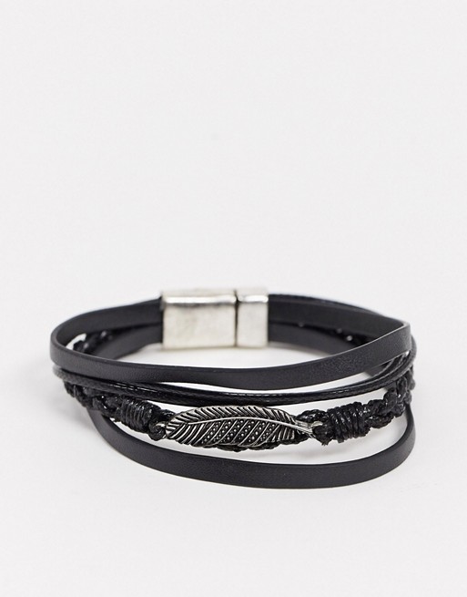 ASOS DESIGN chunky faux leather bracelet with feather charm in black