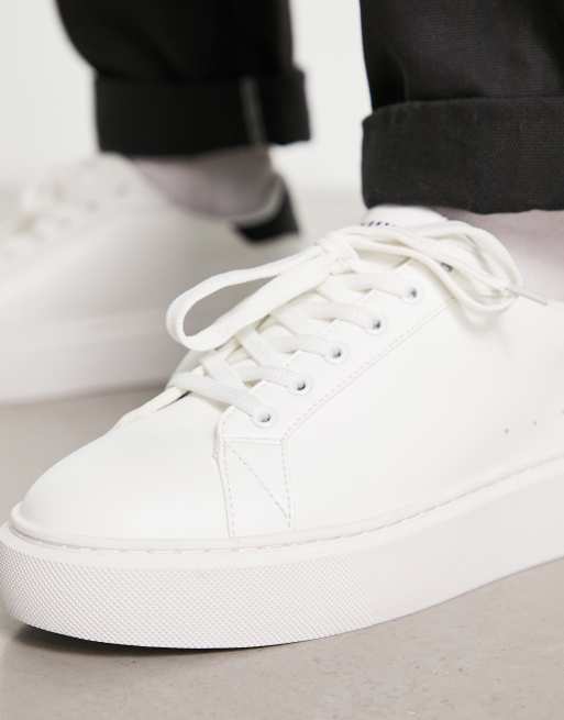 ASOS DESIGN lace-up sneakers in white with embossed monogram