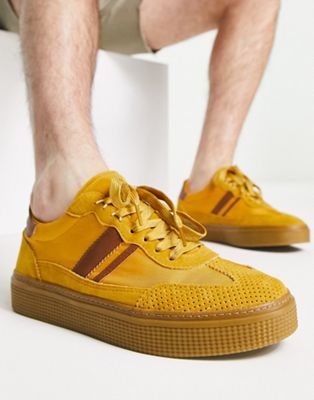 ASOS DESIGN chunky retro trainer in mustard faux suede with gum sole